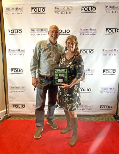 Jimmy Orth and Lisa Rinaman accepting the FOLIO Weekly Best Environmental Advocate Award