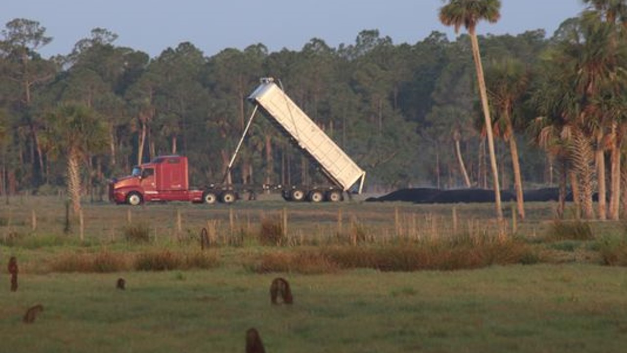 sewage sludge being dumped